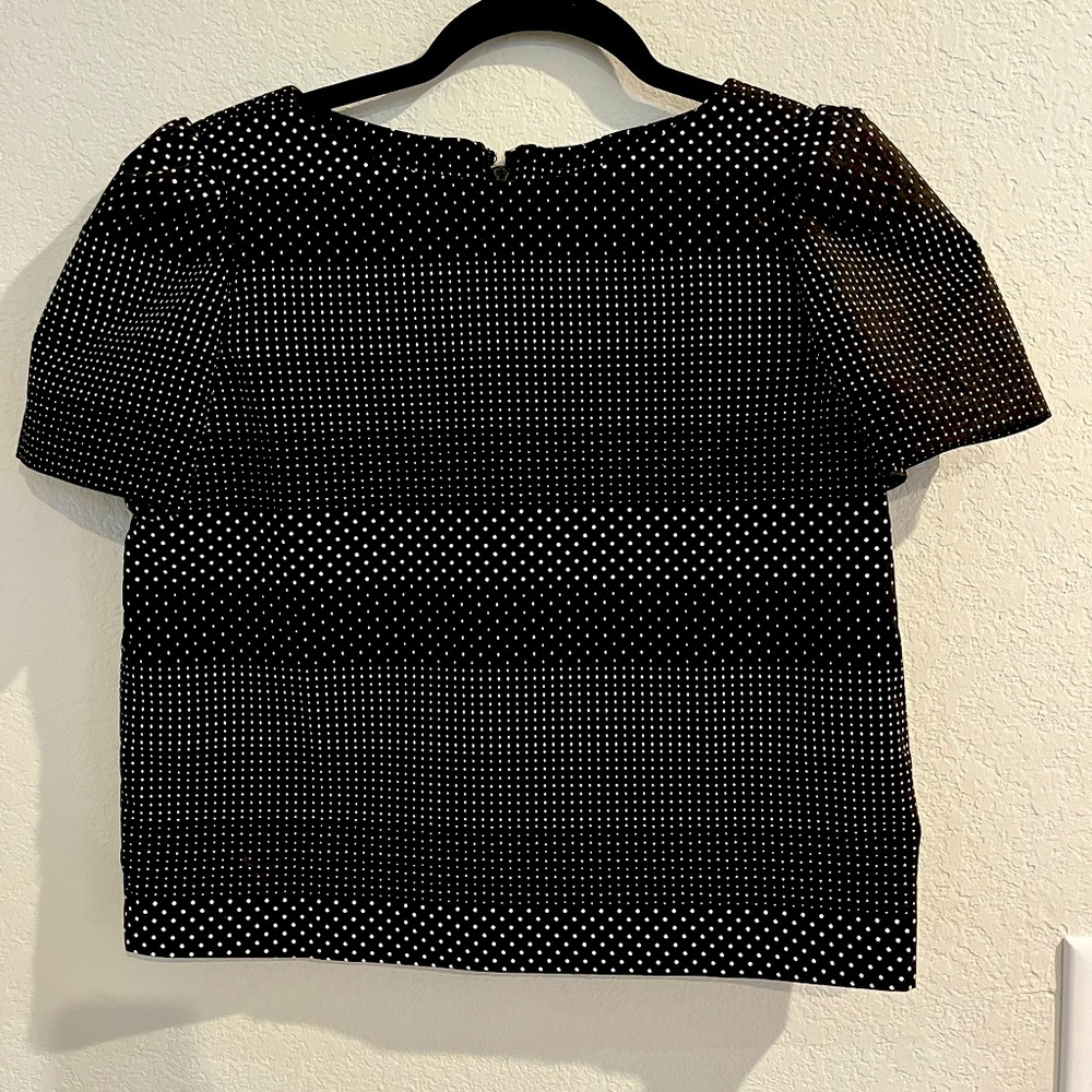 Alice + Olivia top in black with white polka-dots.